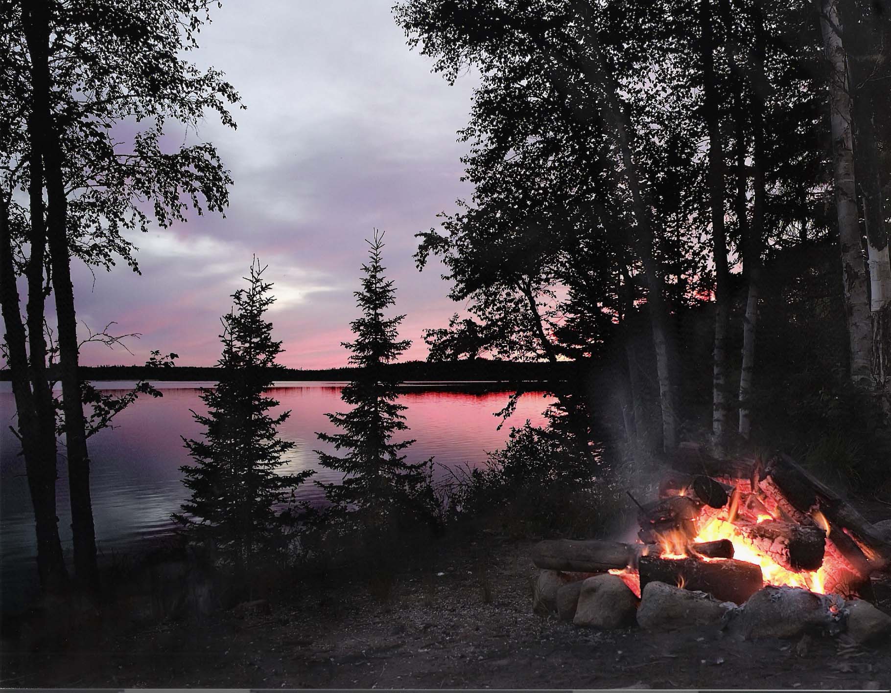 campfire at sunset | Northern Wilderness Outfitters Ltd.